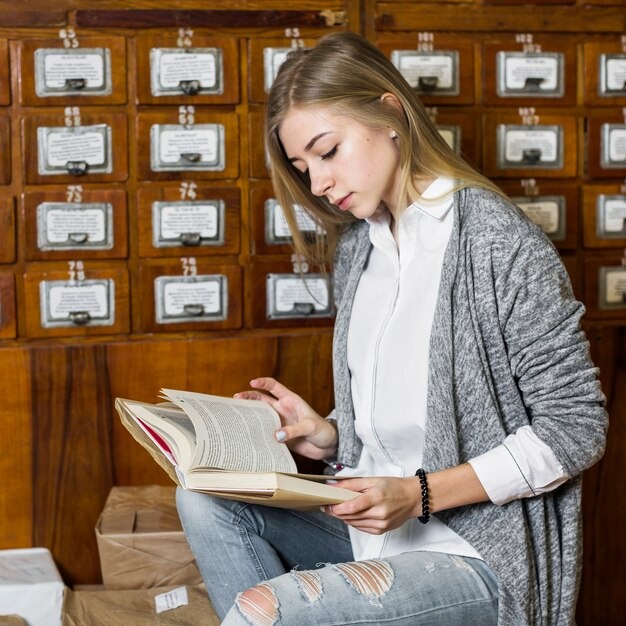 woman reading near packages cata